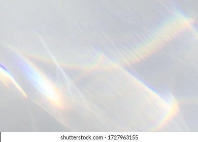Blurred water texture overlay effect for photo and mockups. Organic drop diagonal shadow and light caustic effect on a white wall. Shadows for natural light effects - Shutterstock ID 1727963155