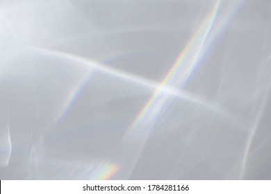 Blurred water texture overlay effect for photo and mockups. Organic drop diagonal shadow and light caustic effect on a white wall. Shadows for natural light effects - Shutterstock ID 1784281166