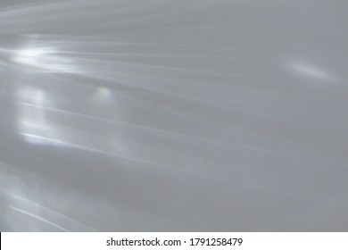 Blurred water texture overlay effect for photo and mockups. Organic drop diagonal shadow and light caustic effect on a white wall. Shadows for natural light effects - Shutterstock ID 1791258479