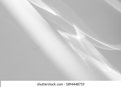 Blurred water texture overlay effect for photo and mockups. Organic drop diagonal shadow and light caustic effect on a white wall. Shadows for natural light effects - Shutterstock ID 1894448719