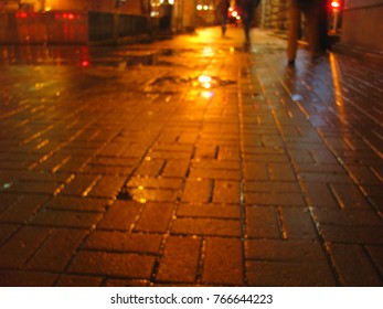  blurred wet surface, pavement, reflection of lights on the roadnight, 