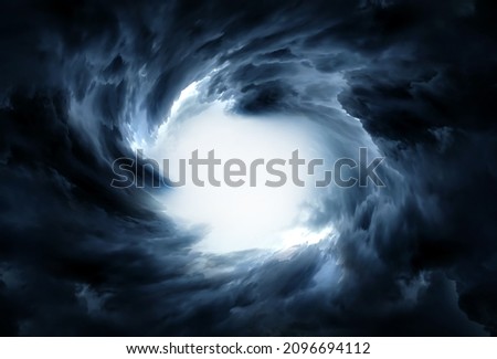 Blurred Whirlwind with a Light in the Dark Storm Clouds