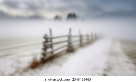 Blurred Winter Background of Snowy Field with Rustic Wooden Fence in Fog - Powered by Shutterstock