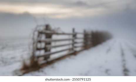 Blurred Winter Background of Snowy Field with Rustic Wooden Fence in Foggy Landscape - Powered by Shutterstock