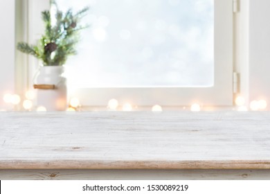 Blurred Winter Holiday Background With Vintage Wooden Table In Front