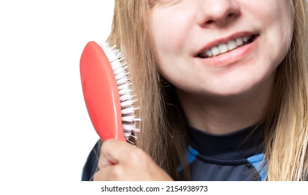 Blurred Woman Combing Wet Hair With Massage Comb On White Background.