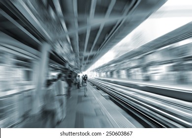 blurred woman stand waiting metro train at  station background, transportation in urban city - Powered by Shutterstock
