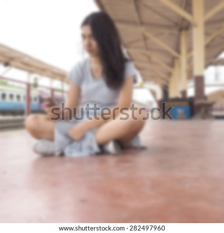 blurred woman using smart phone
