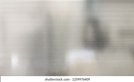 Blurred Women Behind Translucent Polycarbonate Wall Texture Background.