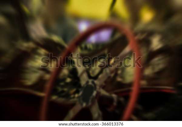 Blurred of\
Zoom at classic car console with steering wheel in Car show event\
at Bangkok, Thailand.  Vintage\
style.