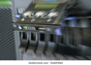 Blurred zoom of Computer Server with panel and raid storage in datacenter
