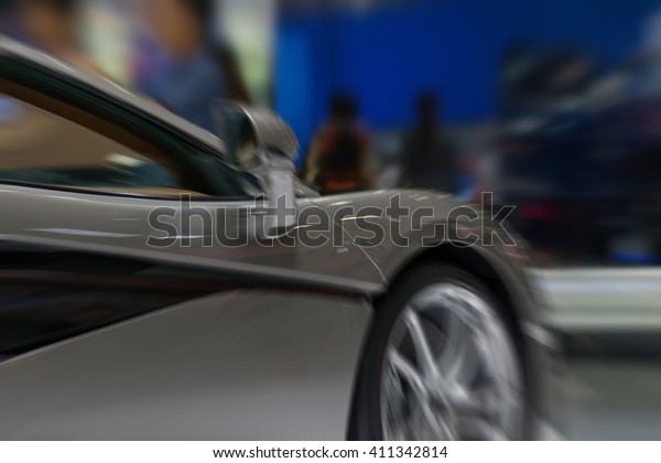 Blurred zoom\
of Some parts of the car show event.\
