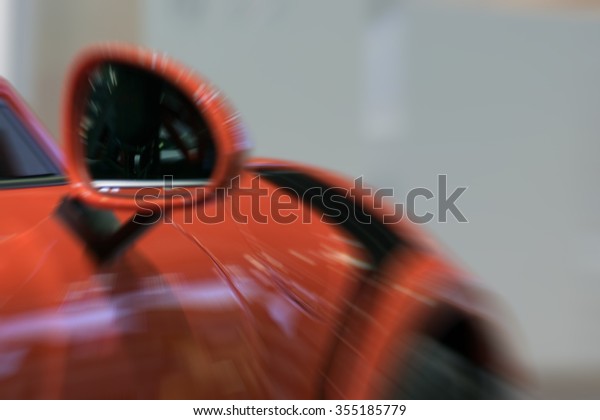 Blurred Zoom at sports car mirror\
and fender in Car show event with light bokeh at Bangkok, Thailand.\
This a open event no need press credentials\
required.