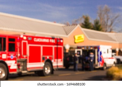 Blurring Background With An Ambulance, Firetruck And People. Emergency Concept