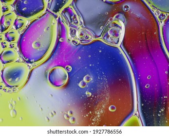 blurry abstract background of colored soap bubbles in water   