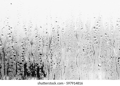 Blurry Abstract Background Of Foggy Condensation On Window Glass Natural Surface. Grey Glass Texture Wallpaper