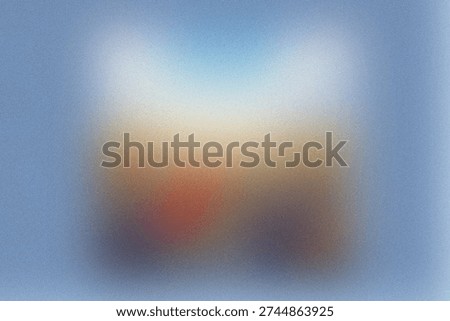 Blurry abstract composition with gradient and indistinct shapes blending into hues of blue and brown