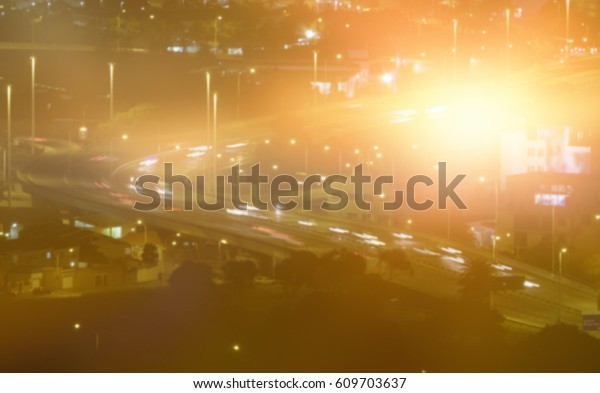 Blurry\
animated flare against traffic lights at\
night