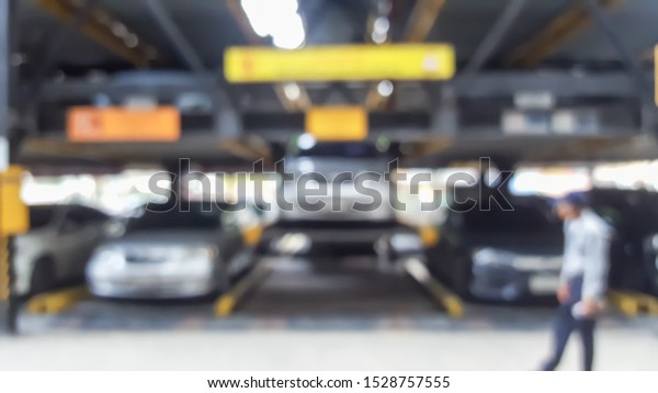 Blurry Automated Car\
Park, Smart Park Tower Parking System, Elevator parking,\
Intelligent Parking\
System