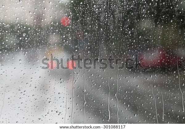 Blurry backdrop. Rainy\
window. View from window to cityscape. Summer autumn rain. Weather\
template.  