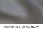 Blurry background with gradient of grey hues with noise effect