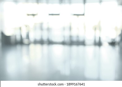 Blurry Background Image Of An Office Lobby With Glass Walls.