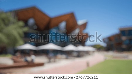 Blurry Background of Innovative View of a Polytechnic Campus Showcasing Modern Architecture, Outdoor Spaces, and Engaged Students Under a Clear Blue Sky