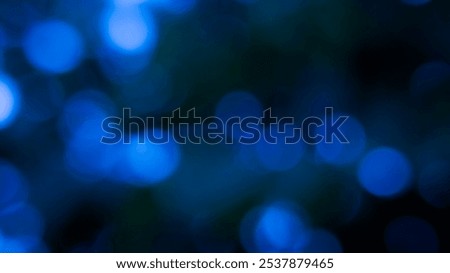 Blurry background with out-of-focus circular light spots that create a dreamy and hazy effect. Dark bokeh photo with blurred light, Background for banner.