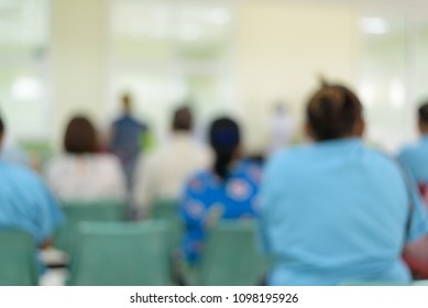 Blurry Background Of Patients Sitting On Chair For Waiting Receive Medicine At Pharmacy Department In Hospital.