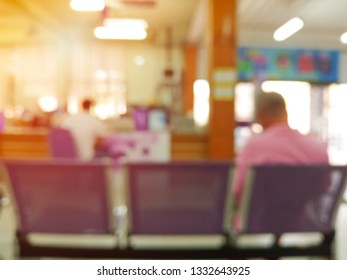 Blurry Background Of Patients Sitting On Chair For Waiting Receive Medicine At Pharmacy Department In Hospital.