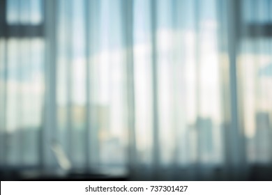 Blurry Background Photo Of Office's Windows In Big City 