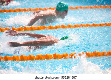 Blurry Background Of Splash Drop Water On Swimming Race With Swimming Competition.