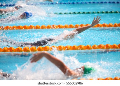 Blurry Background Of Splash Drop Water On Swimming Race With Swimming Competition.