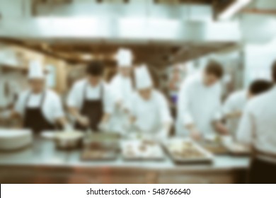 Blurry Background Vintage Color Style Of Chef In Hotel Or Restaurant Kitchen Cooking And Decoration For Luxury Dinner Party.