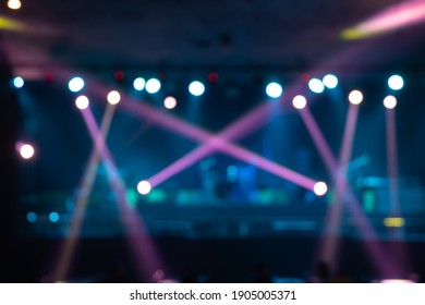 Blurry Bokeh. Stage Concert With Colorful Lighting Laser Beam Spotlight Show In Disco Pub Club Bar Background For Party Music Dancing Festival Performance. Entertainment Nightlife. Celebration Event.