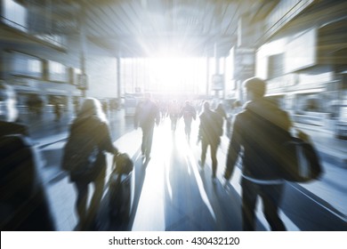 Blurry Business People Walking Down The Street Talking. Silhouettes.