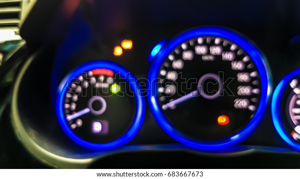Blurry of car dashboard with indicating light\
status background