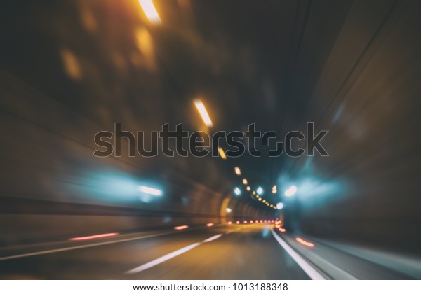 Blurry car tunnel with lights, motion blur\
background, right turn