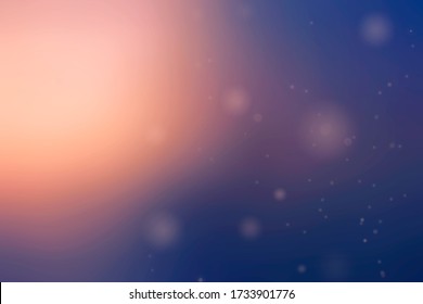 Blurry caramel sunshine dissolves in deep blue space among stars