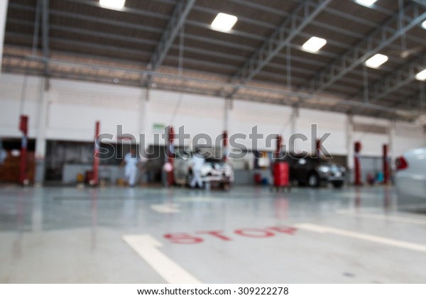 blurry cars  service\
station for background