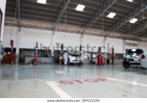 blurry cars  service\
station for background
