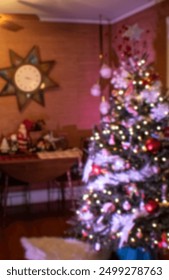 Blurry Christmas tree in a vintage mid-century styled living room during the holidays.