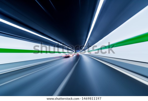 Blurry chromatic color tunnel car traffic motion\
blur.car driving through tunnel\
