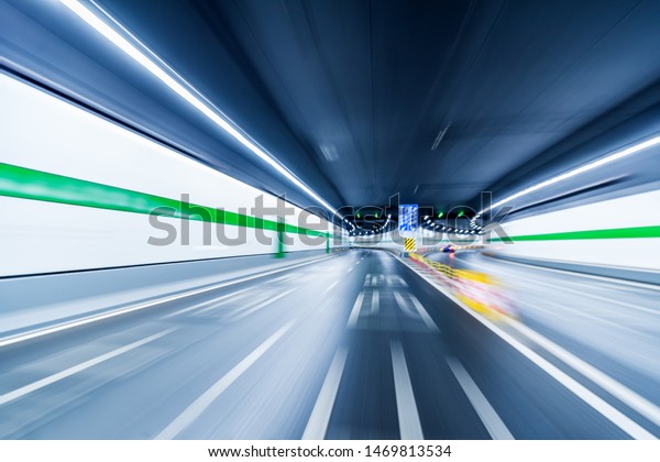 Blurry chromatic color tunnel car traffic motion\
blur.car driving through tunnel\
