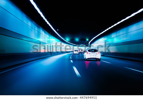 Blurry chromatic\
color tunnel car traffic motion blur. Motion blur visualizies the\
speed and dynamics.