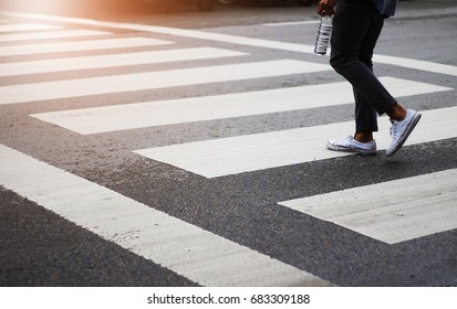 Blurry City Street People On Zebra Crossing