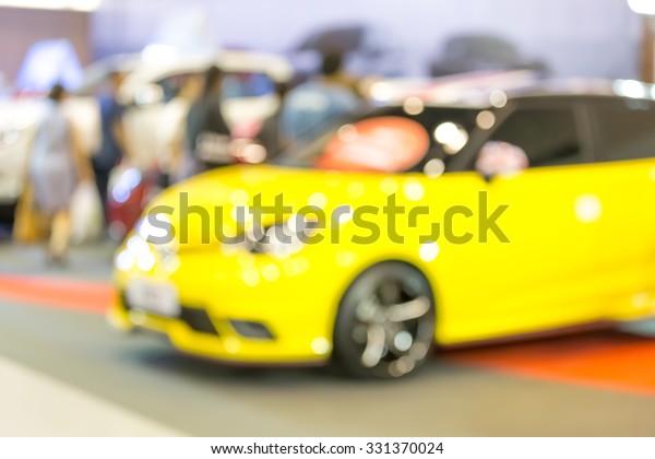 Blurry commercially cars in\
car shop