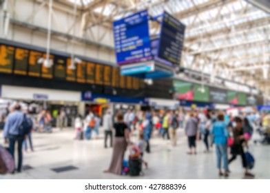 Blurry Crowded Bokeh Background Of Train Station.