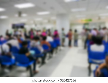 Blurry Defocused Image Of People Standing And Sitting In Public Hospital