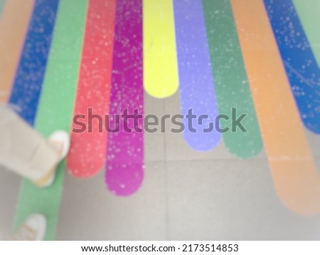 Blurry defocused multicoloured background with space for runaround or wraparound text 